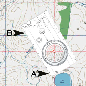 Lay the baseplate of the compass flat on the map so that the edge goes between your position and the destination.
